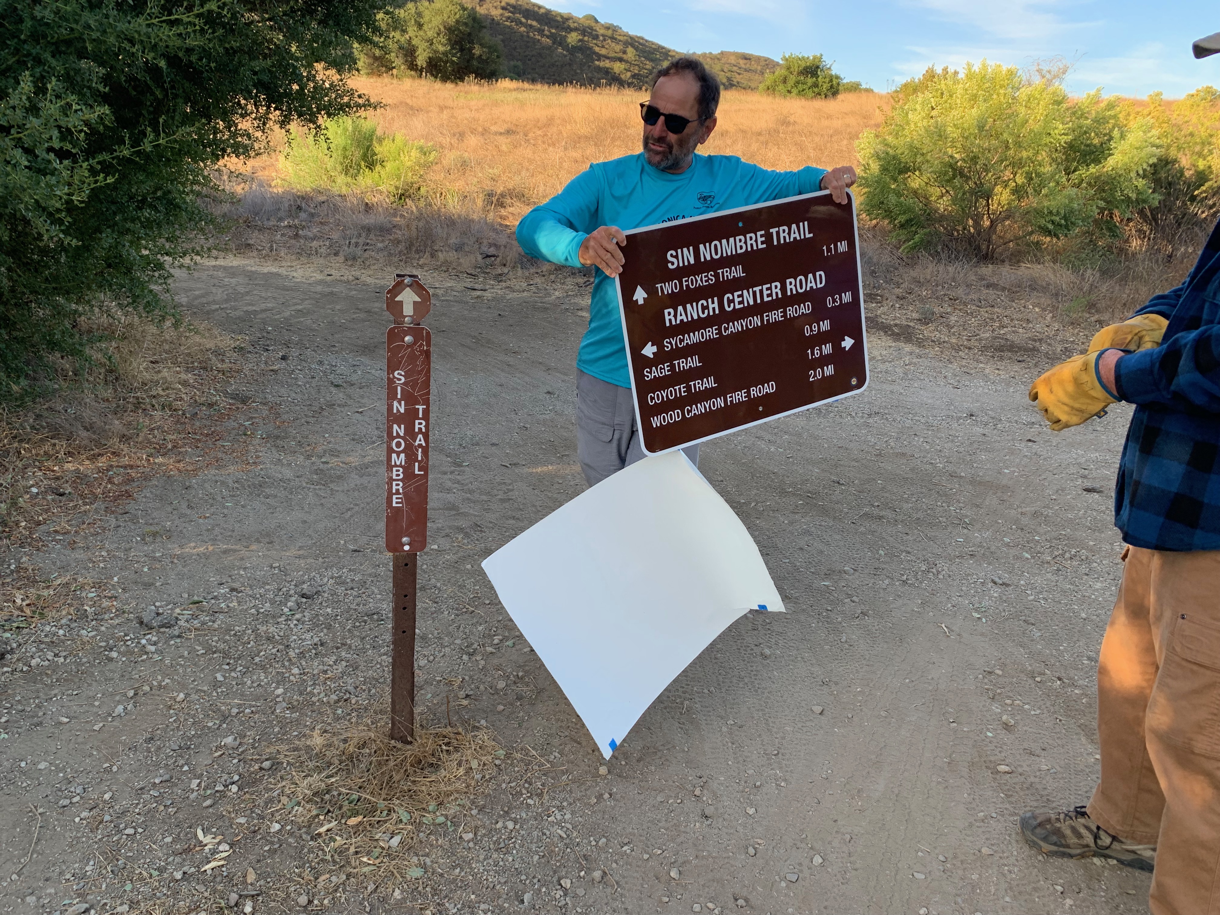 Jon Sheldon installing a Sign