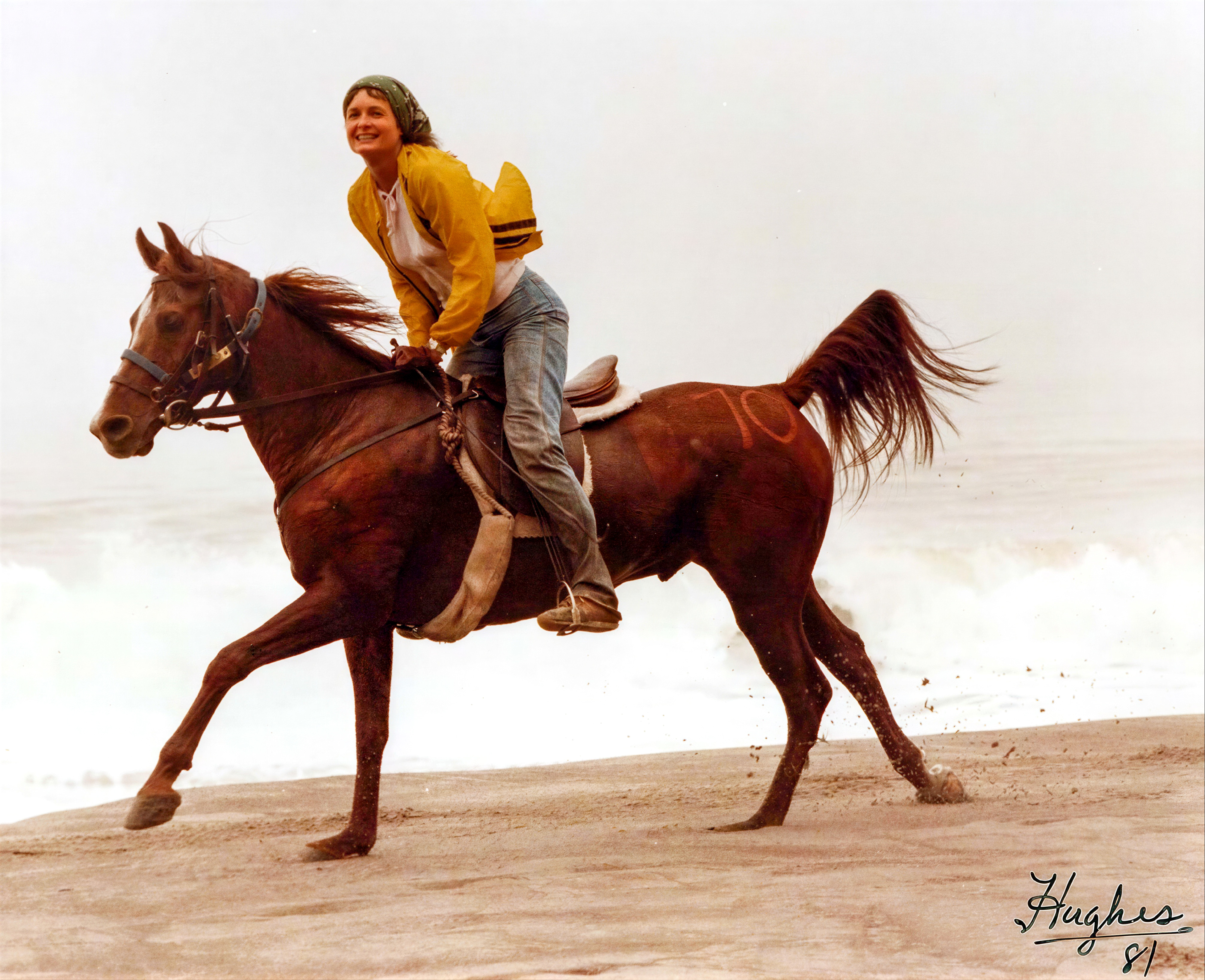 Linda riding along the beach